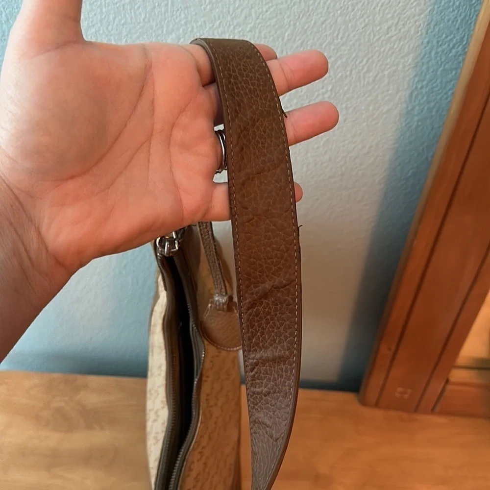 Dooney and Bourke classic monogram canvas and leather Tan color small hobo bag